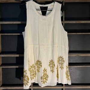Anthropology Light Cream Top with Sequence Designs at the Bottom!